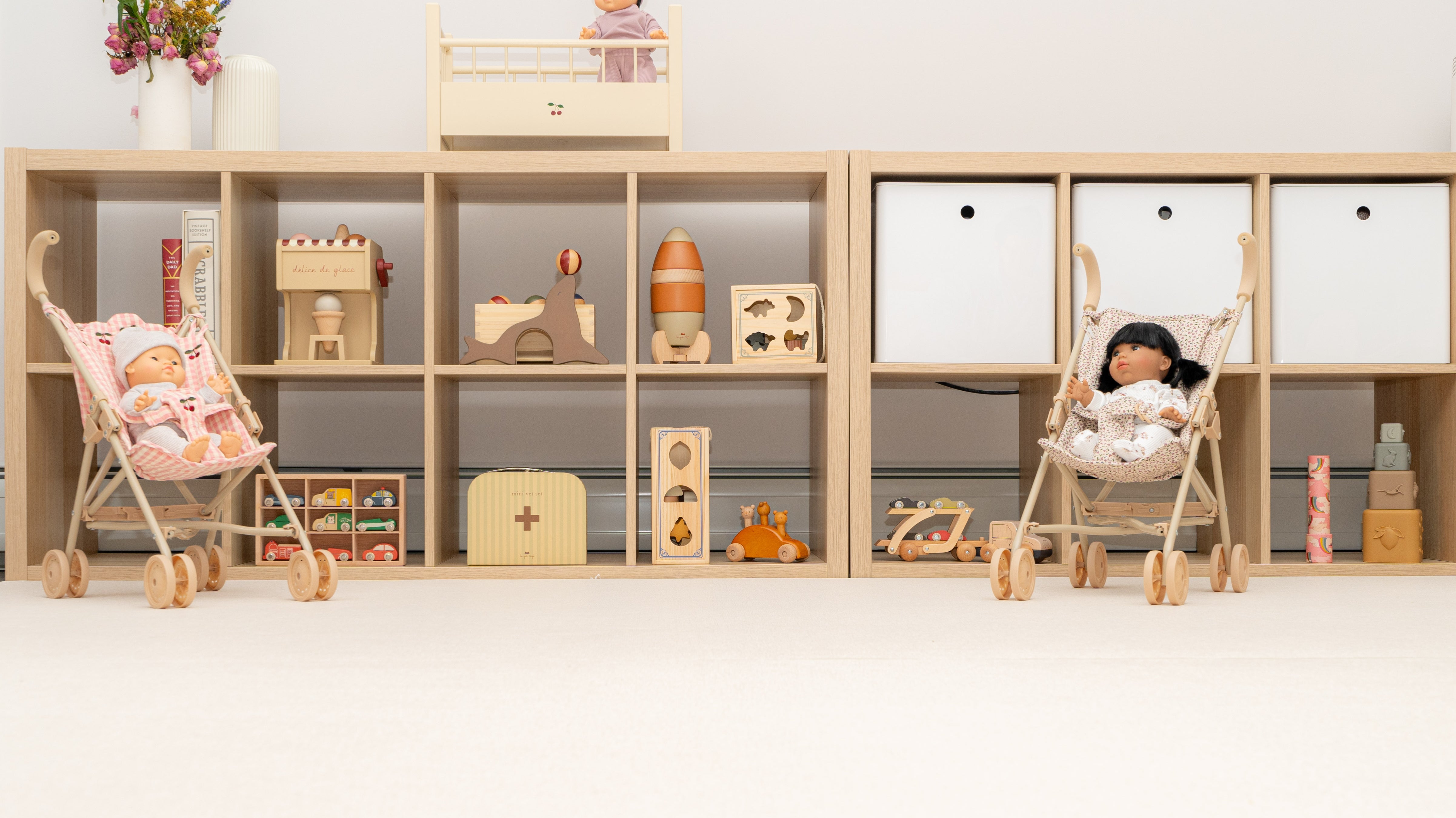 Child playing with toys and doll accessories to spark imagination