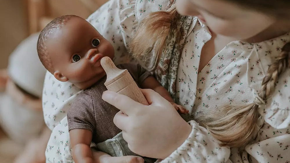 Minikane doll with vanilla-scented vinyl construction and realistic features for children 3 years and older
