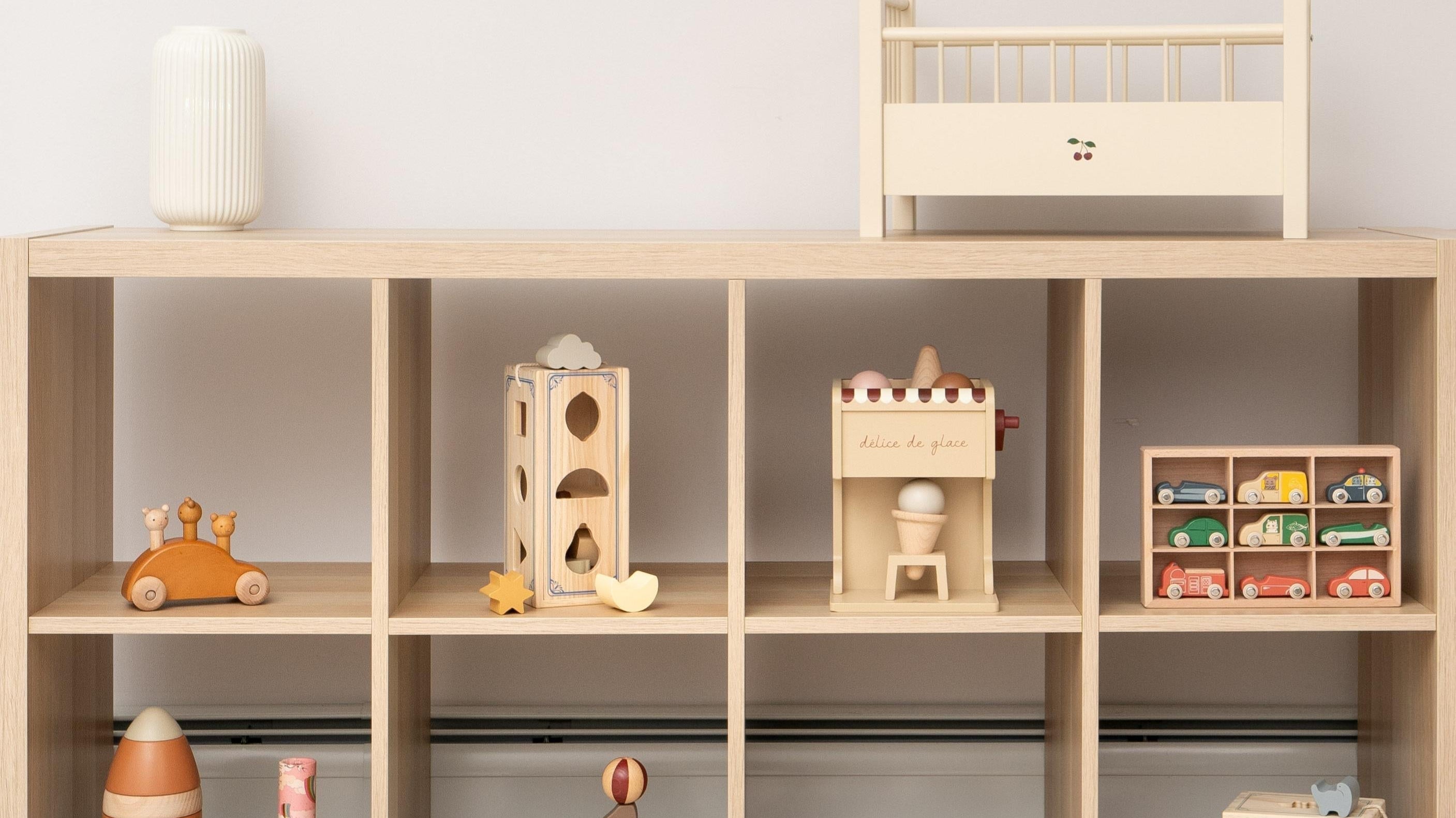 Safe wooden toys arranged in modern playroom showing quality craftsmanship and child-friendly design