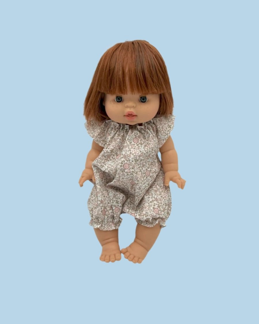 Holiday-themed doll clothing collection in festive colors