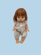 Holiday-themed doll clothing collection in festive colors