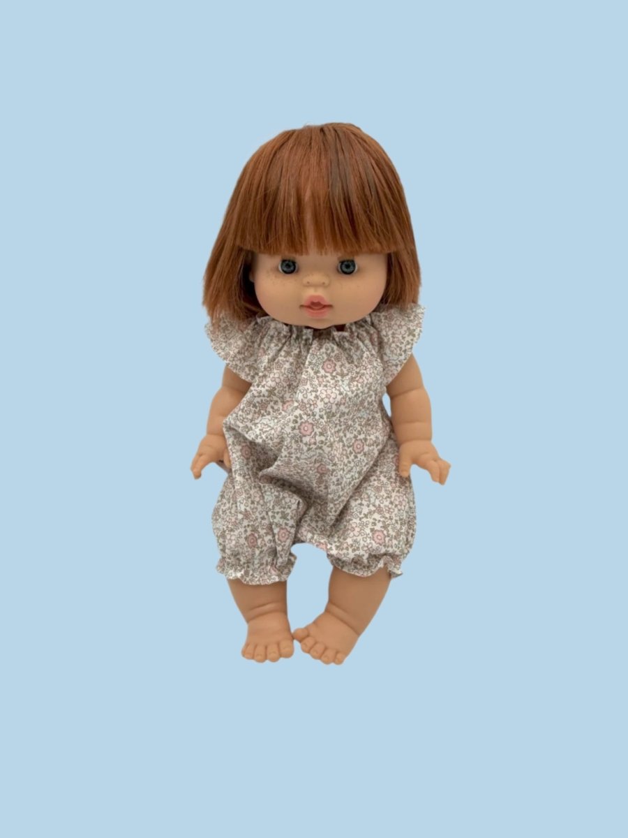 Holiday-themed doll clothing collection in festive colors