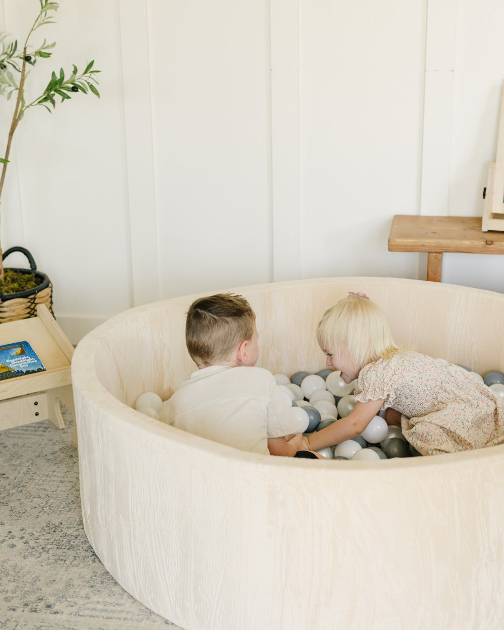 2 Children Laughing in Ball Pit