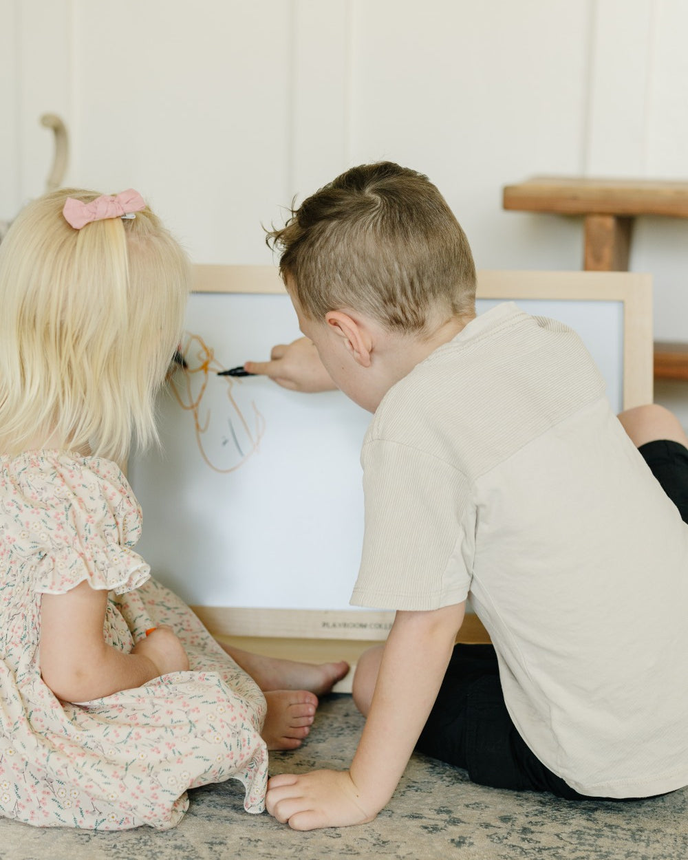 2 Children on Tabletop Easel