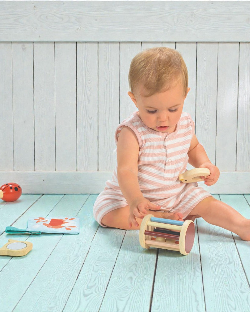 Five developmental baby toys from Mentari for 6-12 month olds with garden theme