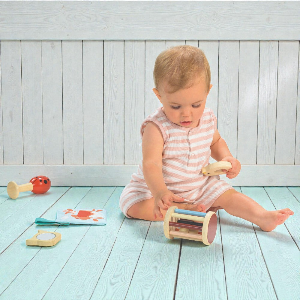 Five developmental baby toys from Mentari for 6-12 month olds with garden theme