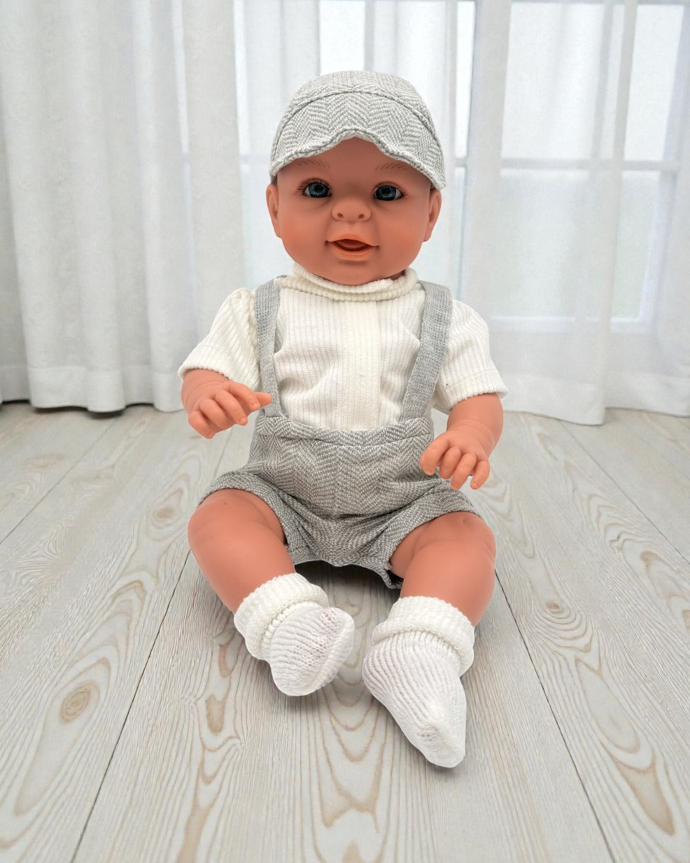 Handcrafted 18-inch Bebenita baby boy doll with hand-painted eyes in European grey herringbone outfit