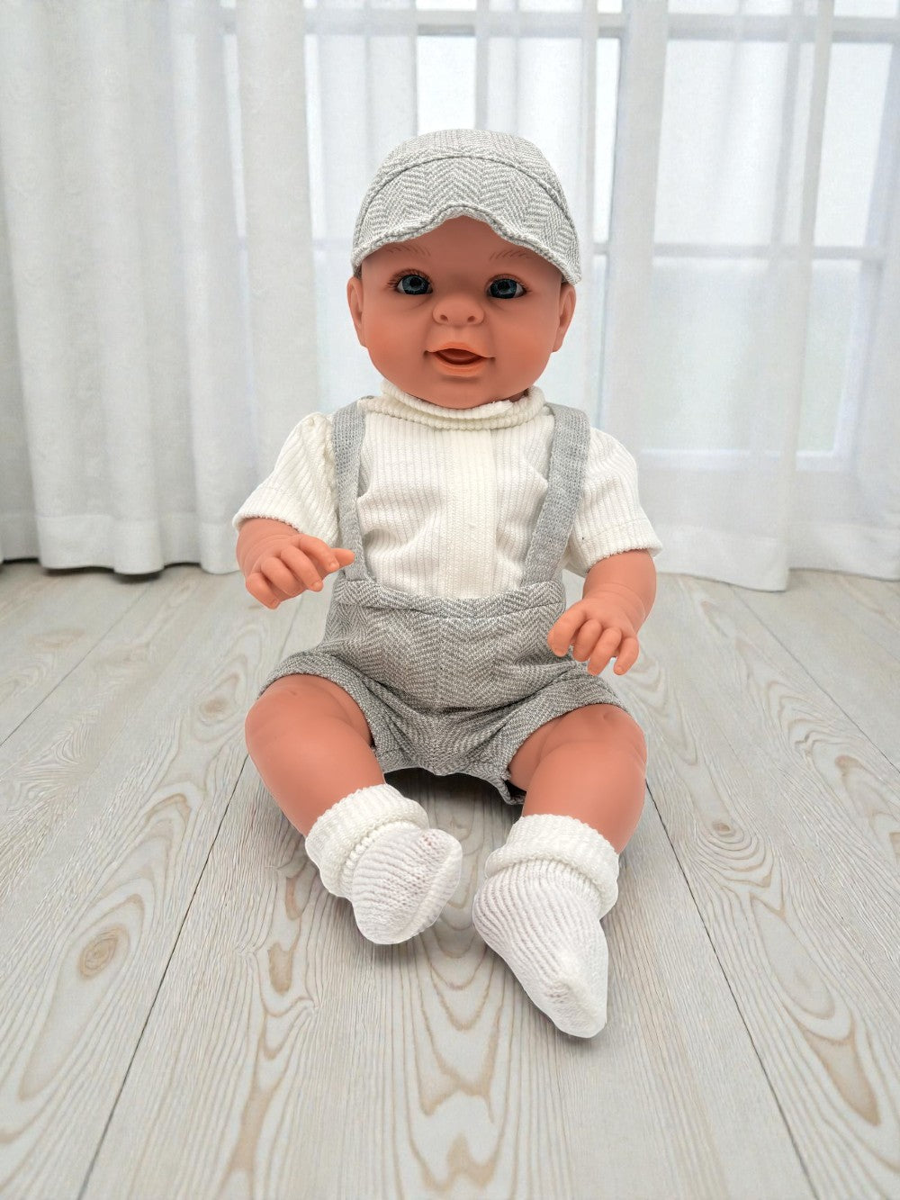 Handcrafted 18-inch Bebenita baby boy doll with hand-painted eyes in European grey herringbone outfit