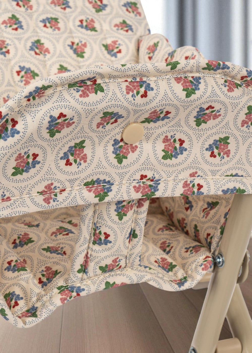 Close-up of Verona Blues cottage floral fabric with botanical print on padded doll high chair