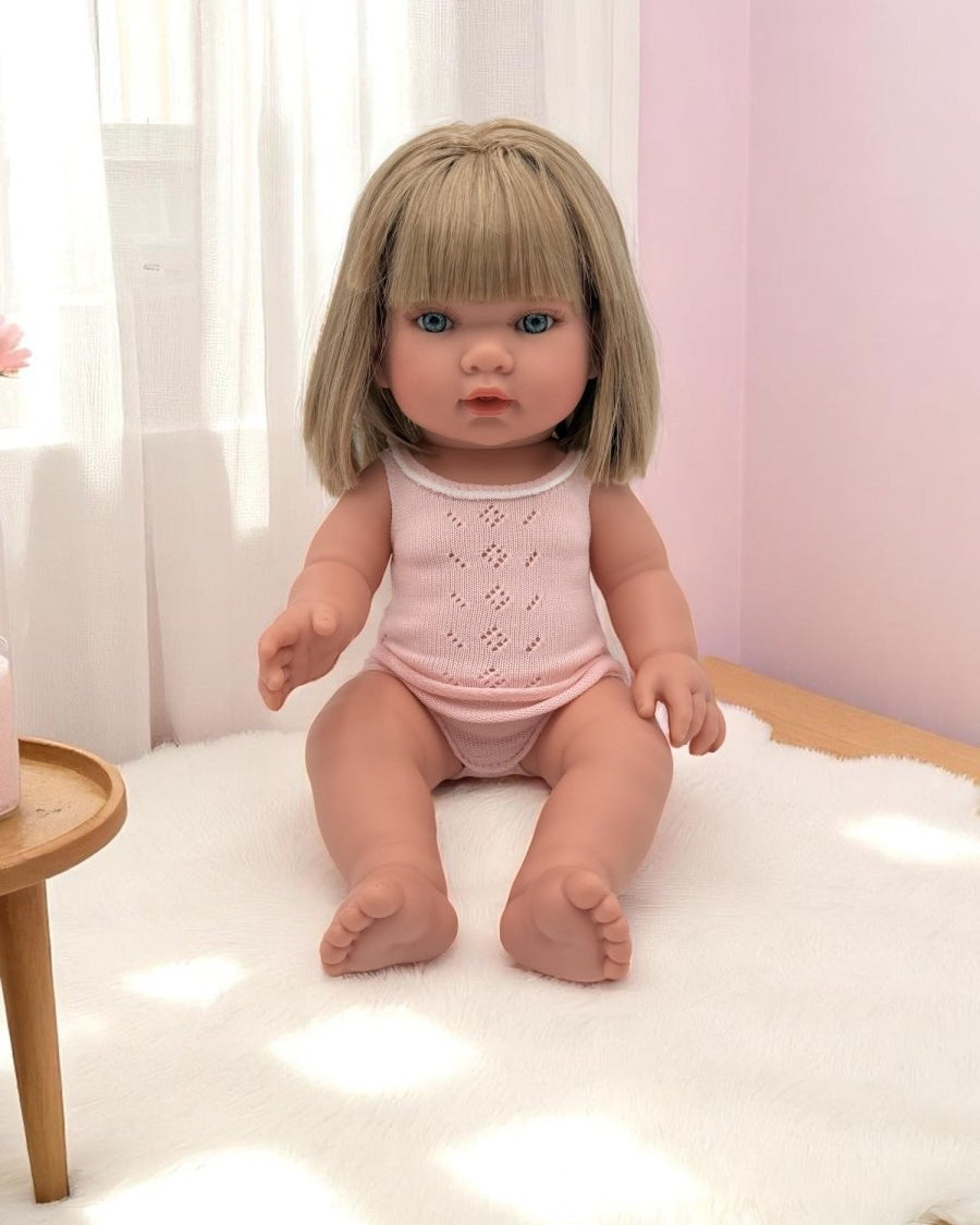 Adelaide blonde bob blue eyes white knit outfit baby doll