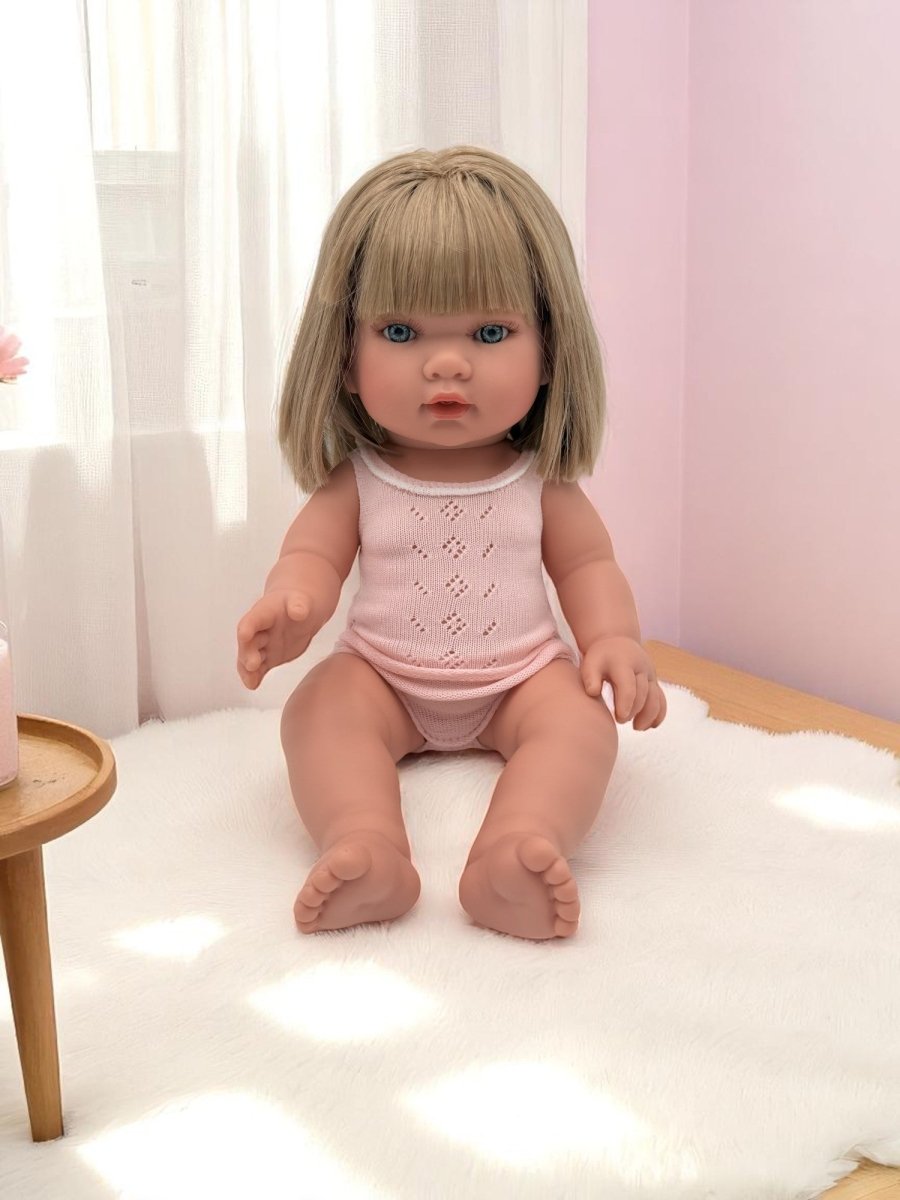 Adelaide blonde bob blue eyes white knit outfit baby doll