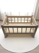 Baby doll cradle with natural birch construction perfect for children's playroom developmental activities