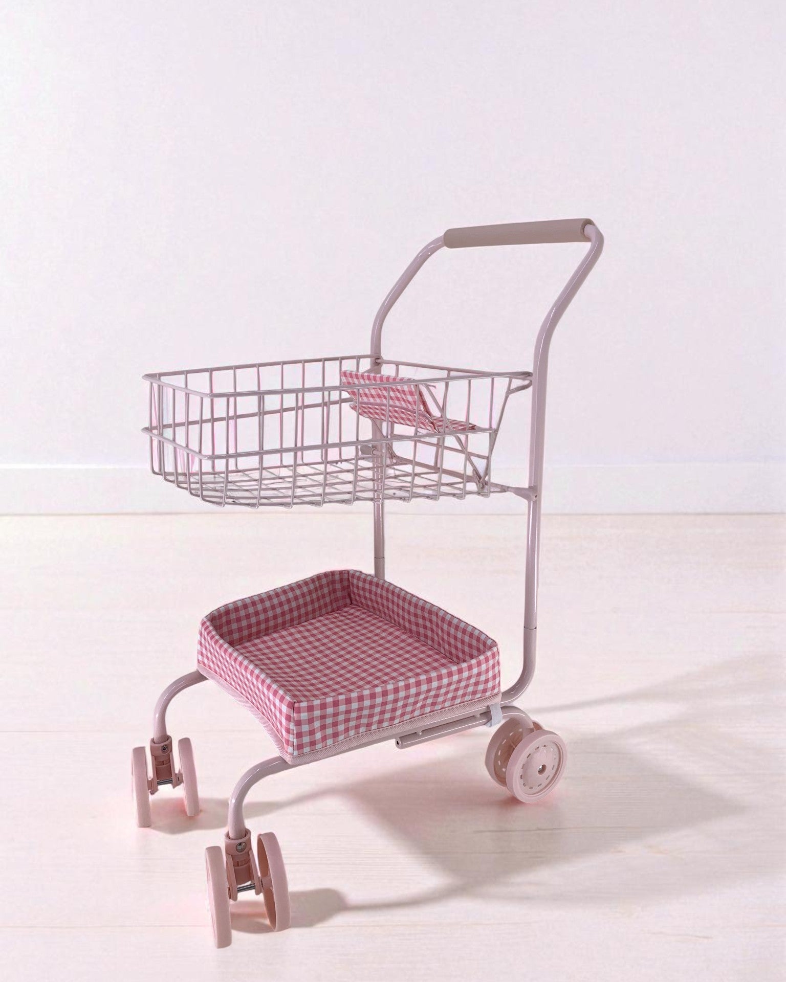 Bubblegum Gingham shopping cart with pink and white check fabric seat, champagne wire basket and smooth-rolling wheels