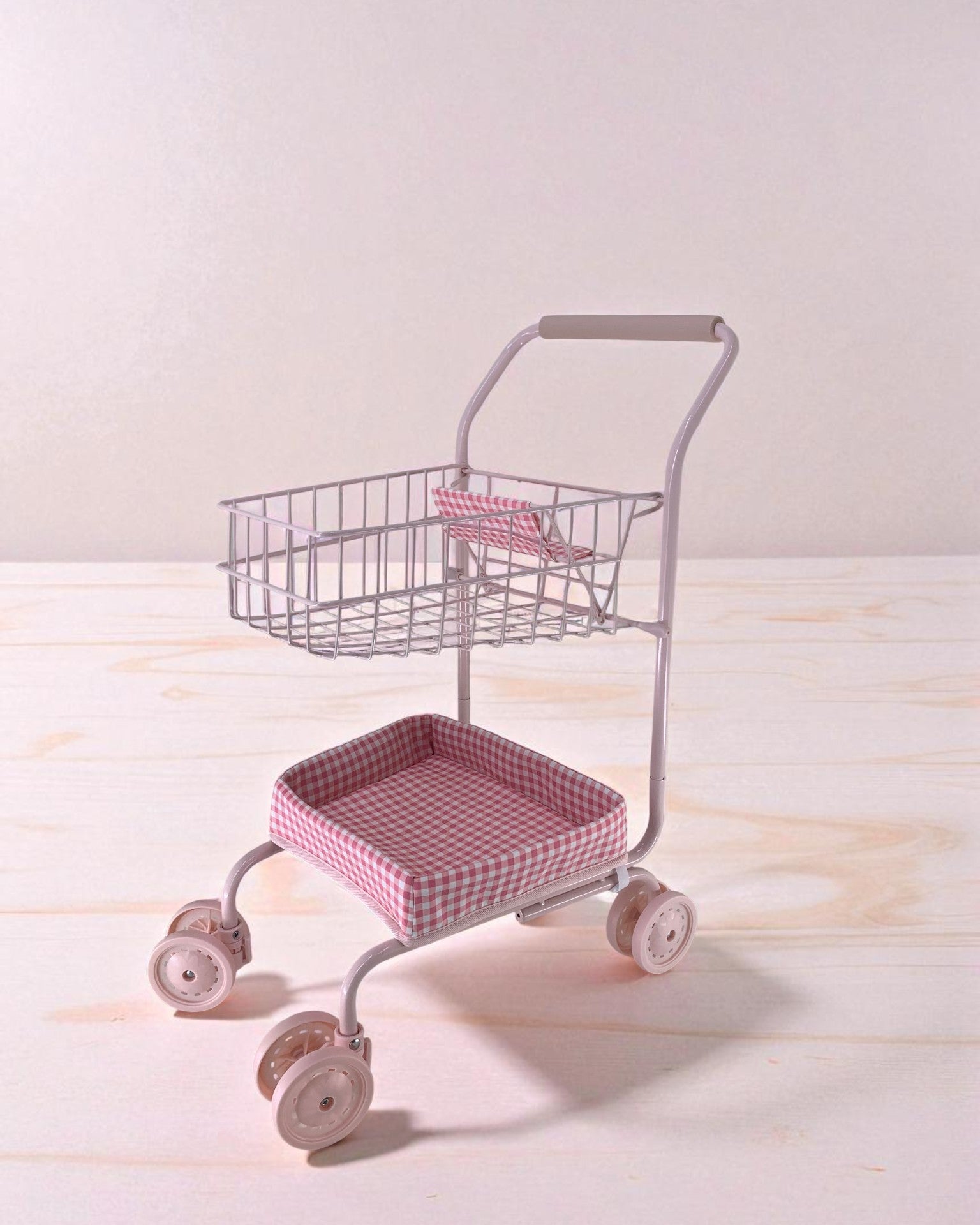 Professional-grade front wheels on shopping cart showing smooth-rolling capability for easy navigation