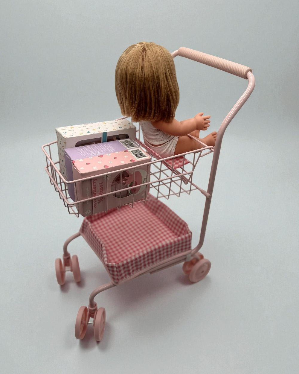 13-inch doll seated comfortably in gingham cart showing perfect proportions for realistic shopping play