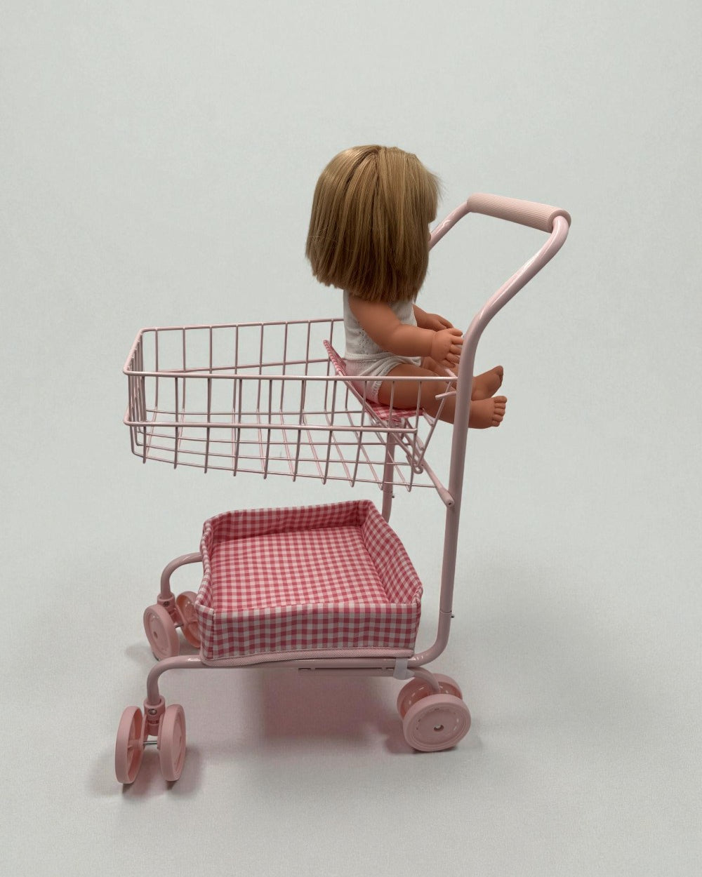 Upper wire basket filled with toy groceries demonstrating generous storage space for shopping adventures