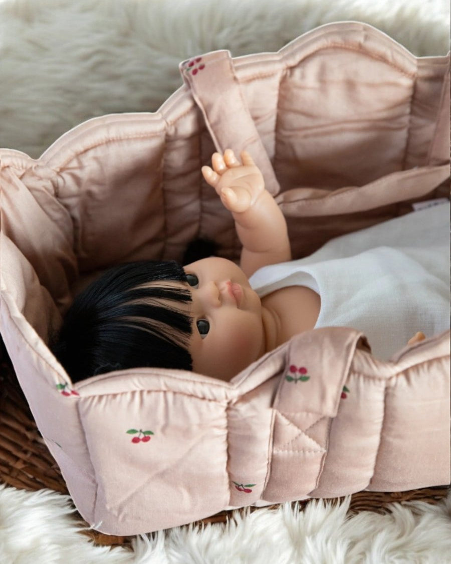 Playroom favorite: natural fiber baby doll bassinet for nurturing play