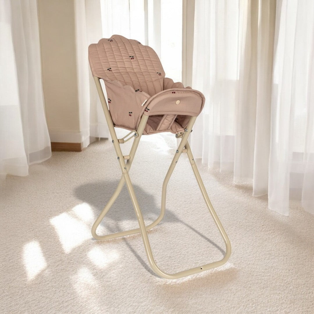 Baby doll high chair with decorative pattern encouraging creative playroom activities