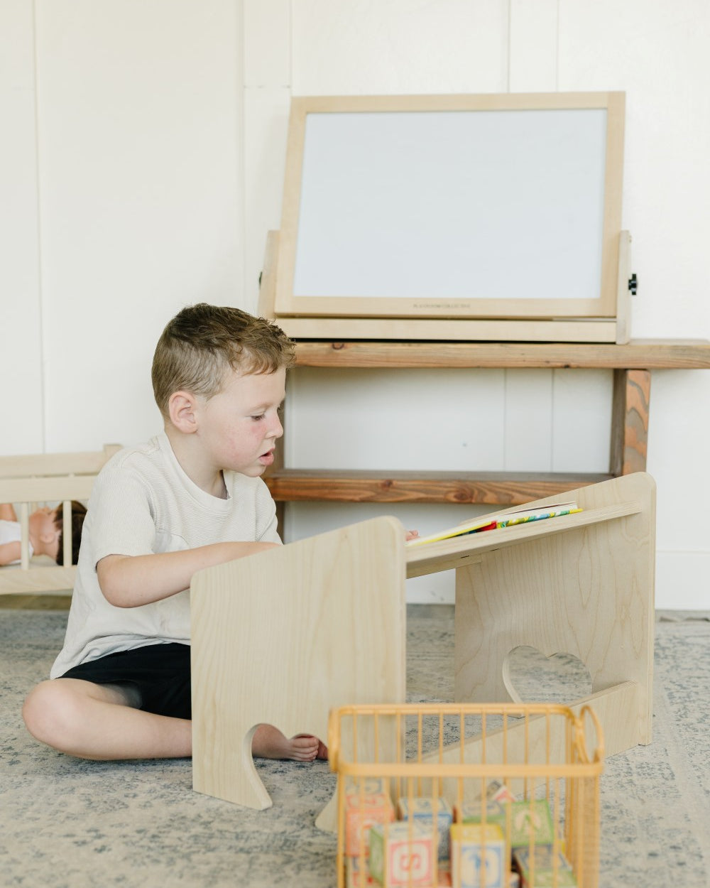 Child reading on lap desk