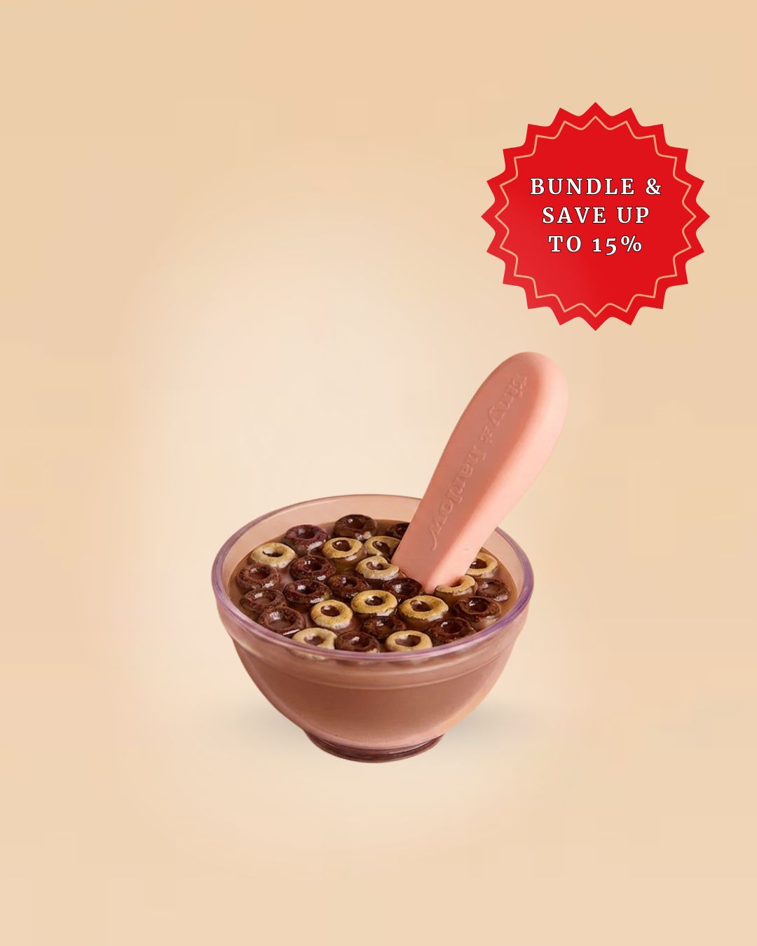 Chocolate cereal toy and a spoon on a beige background.