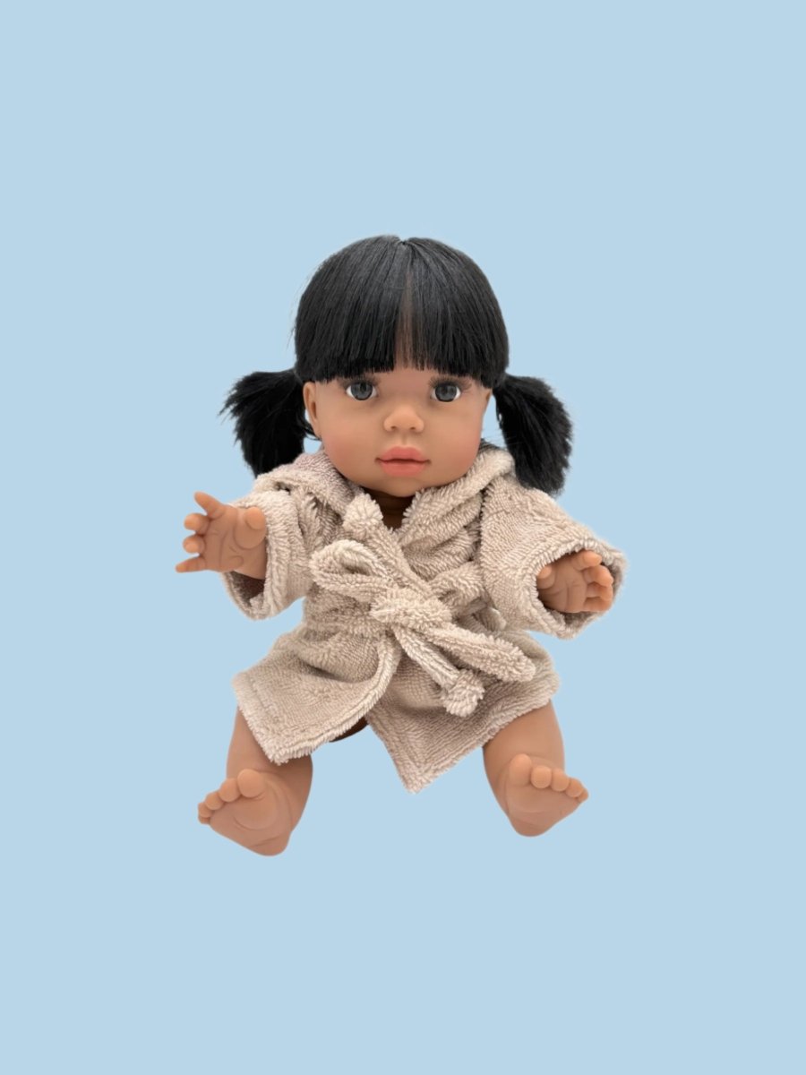 Doll clothes with adaptive features for inclusive play