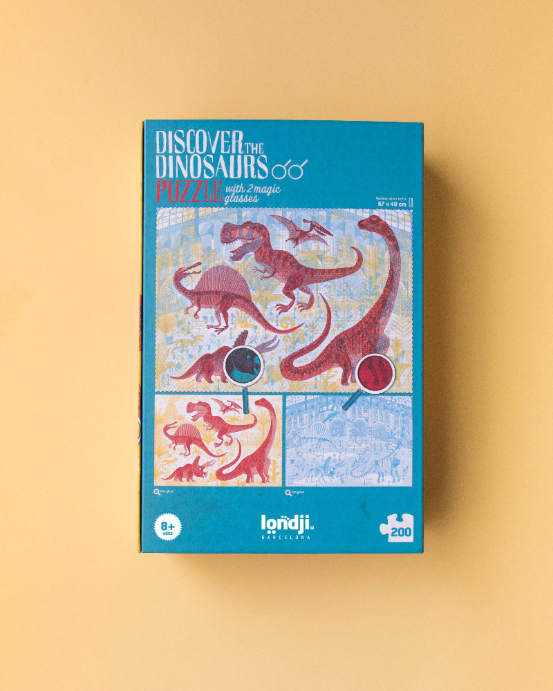 Puzzle box with dinosaur illustrations on a beige background