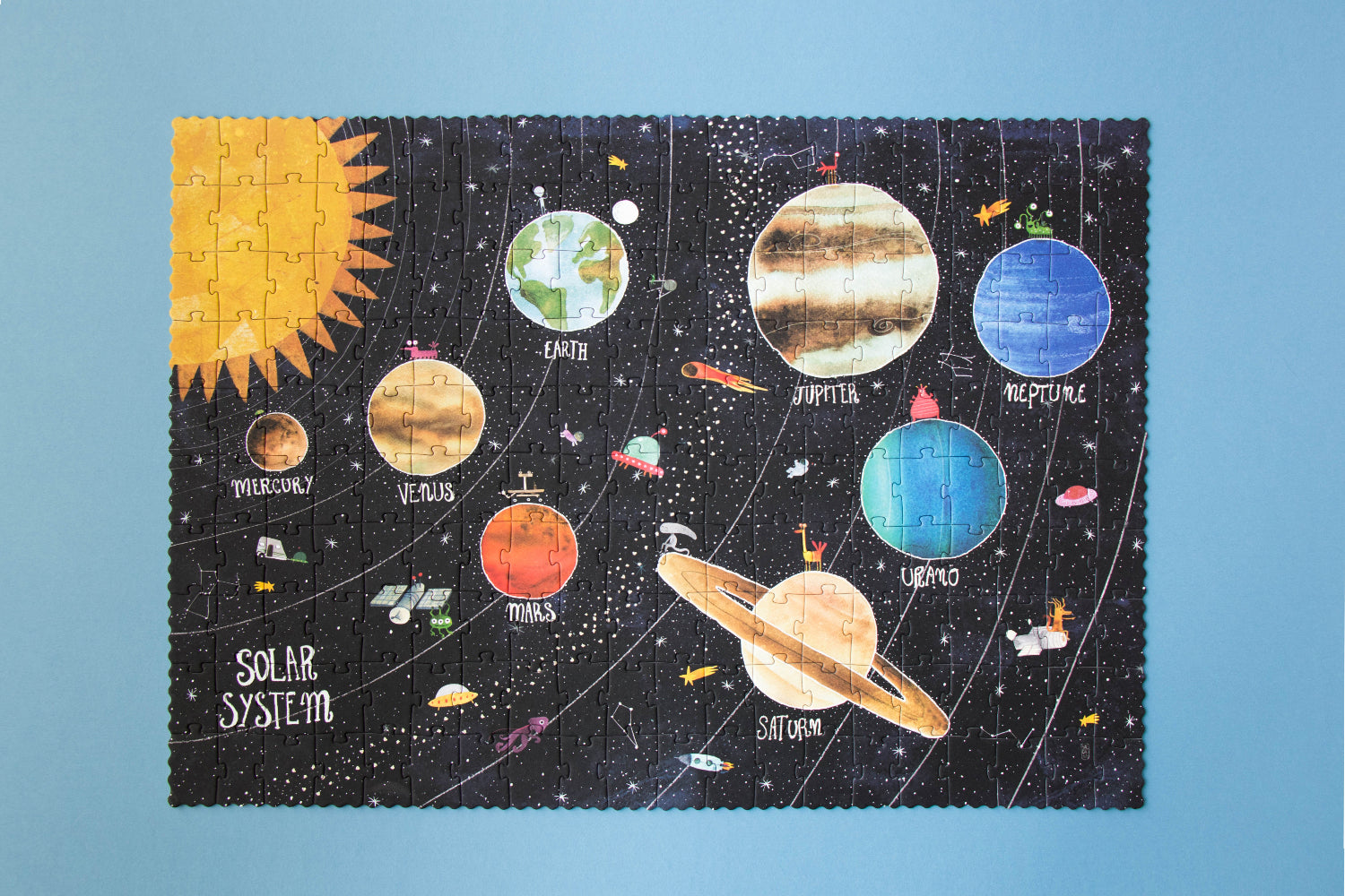 Solar system-themed puzzle on a blue background