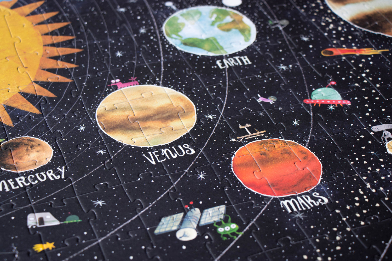 Solar system-themed puzzle with planets and stars on a dark background