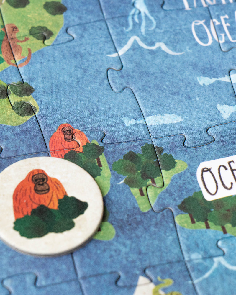 Children's puzzle with a map of Oceania and an orangutan figure.