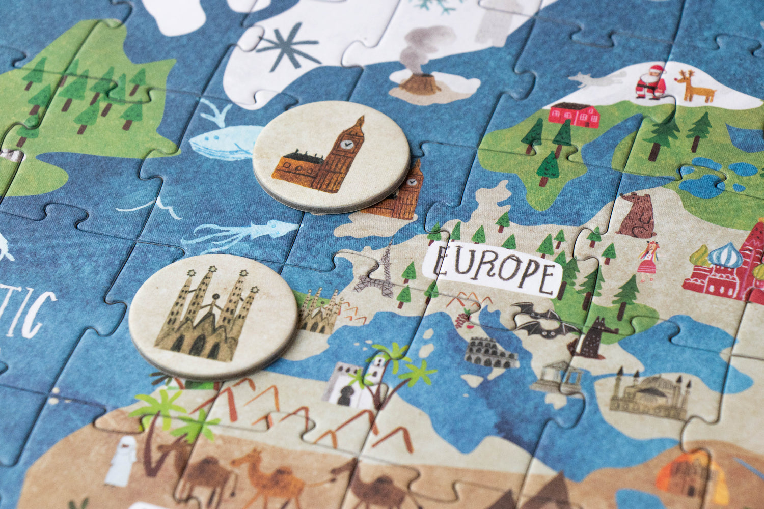 Children's puzzle with a map of Europe featuring landmarks and countries.