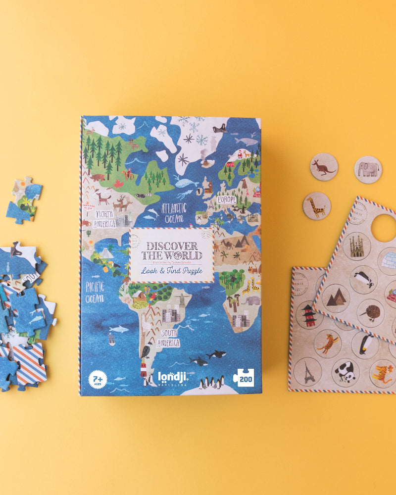 Children's puzzle set with world map design on a yellow background