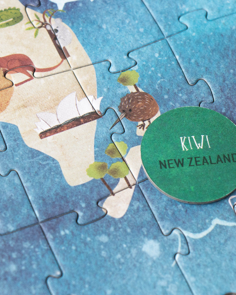 Jigsaw puzzle of New Zealand with a 'Kiwi New Zealand' badge