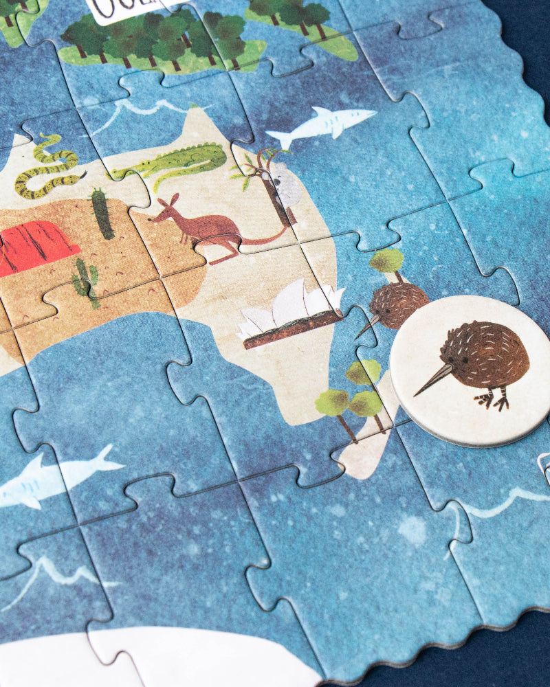 Jigsaw puzzle of Australia with completed pieces and missing ones on a blue background