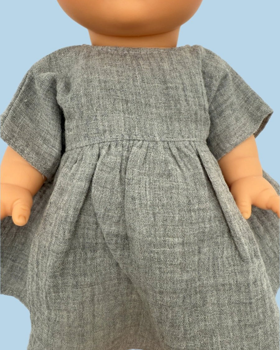 Whimsical baby doll clothes in storytelling themes
