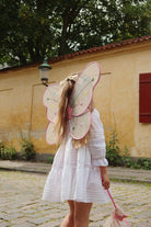 Shimmering white fairy wings with colorful star details and matching wand set