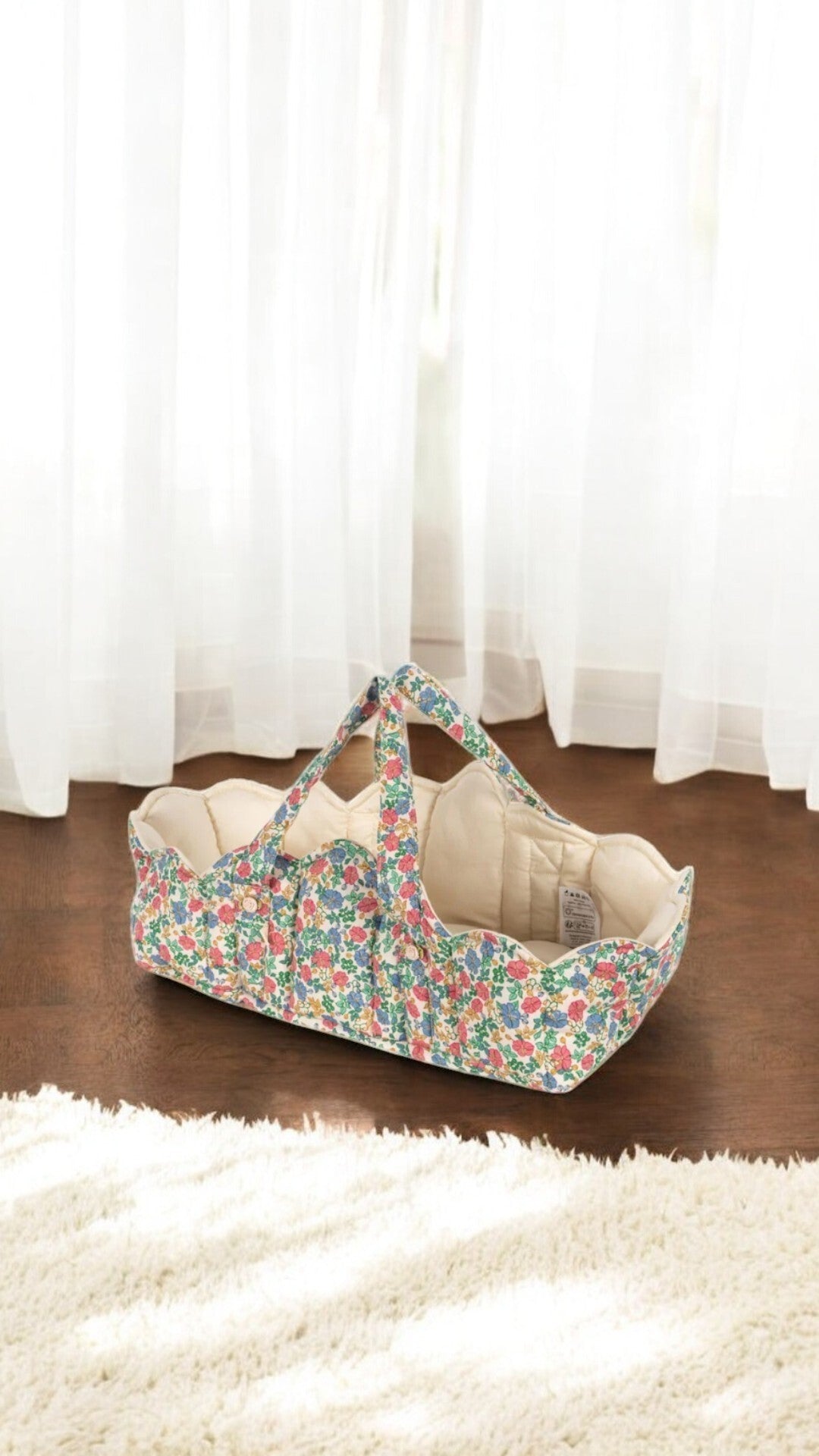 Woven baby doll bassinet for nurturing pretend play in the playroom