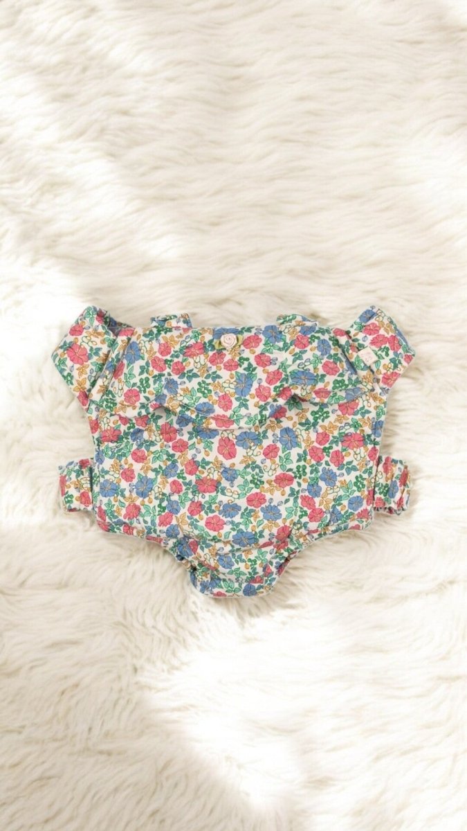 Baby doll carrier with adjustable straps for interactive pretend play in the playroom