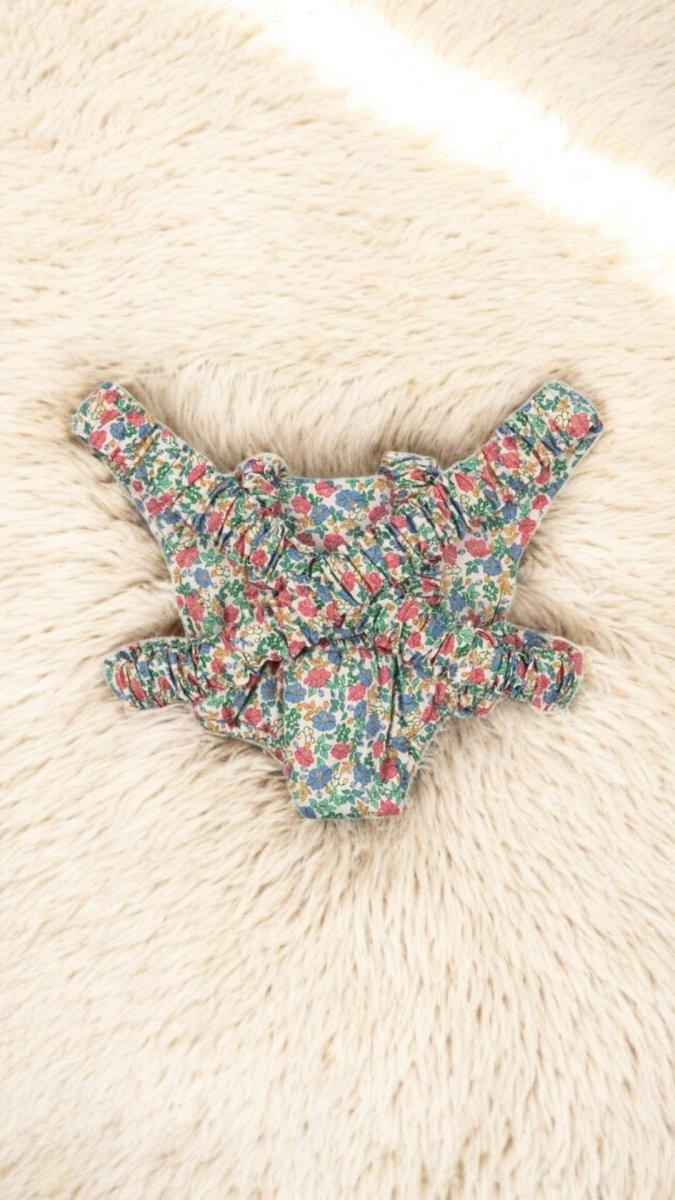 Soft fabric doll carrier perfect for nurturing pretend play activities