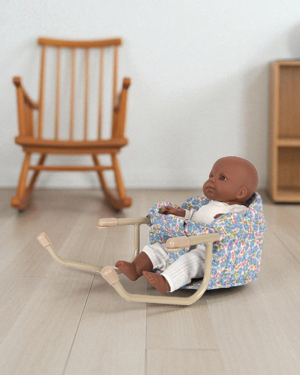 Fleur Rosier table chair with blue floral print fabric and champagne clamp frame, shown with doll seated at table