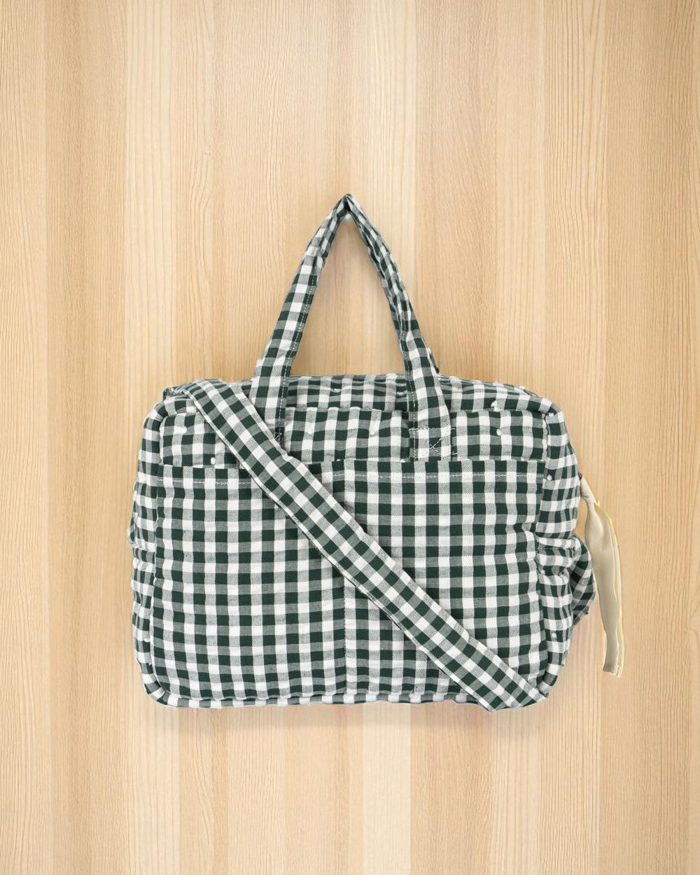 Green gingham check doll diaper bag with adjustable crossbody strap for pretend play
