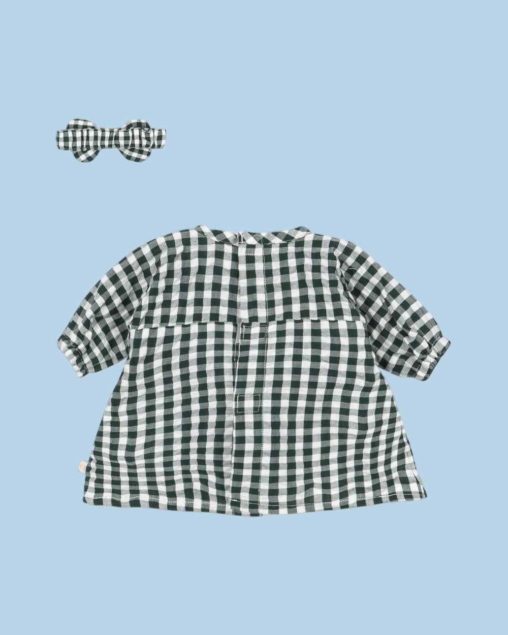 Full view of organic cotton green check dress with empire waist and gathered skirt for doll play