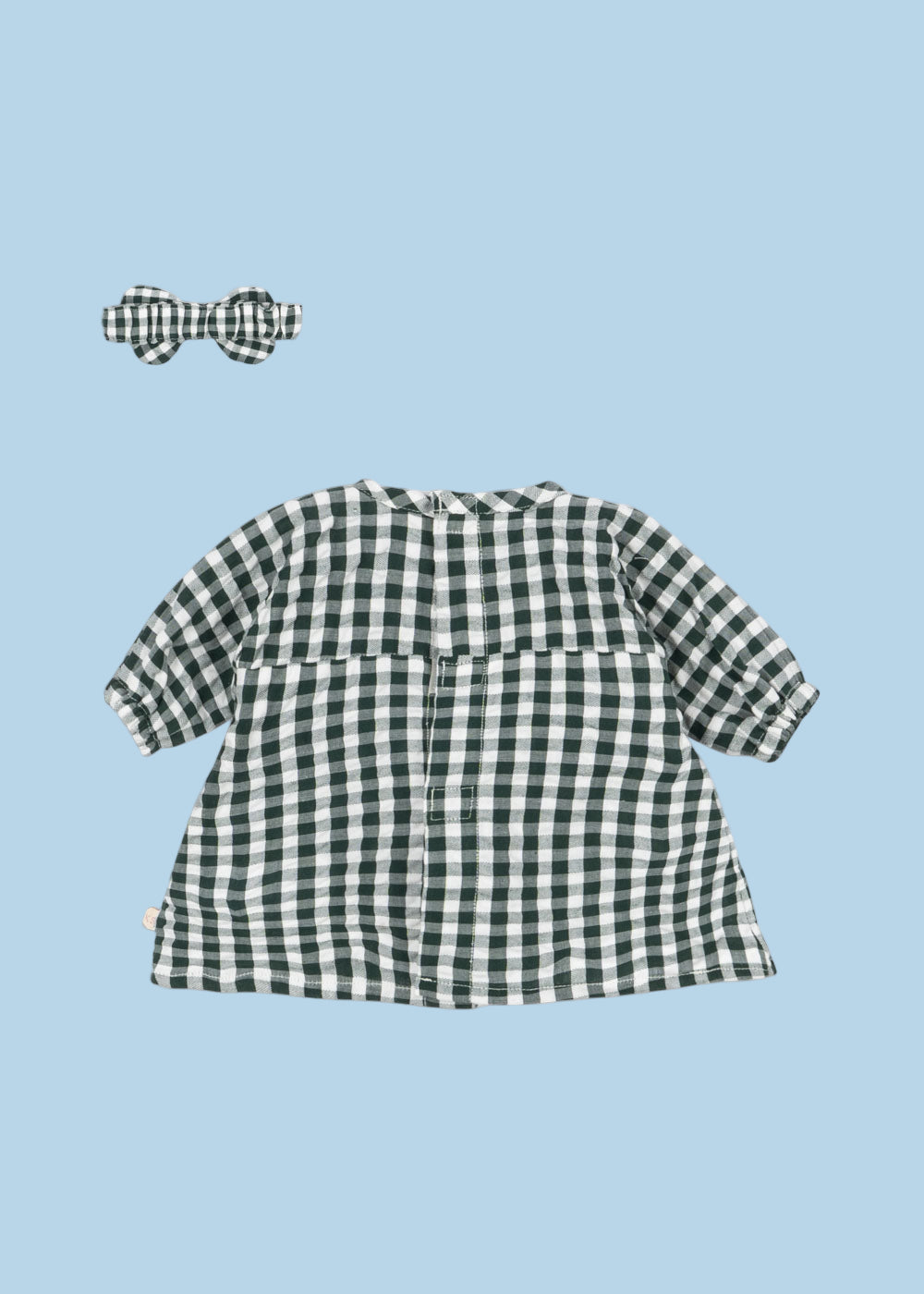 Full view of organic cotton green check dress with empire waist and gathered skirt for doll play