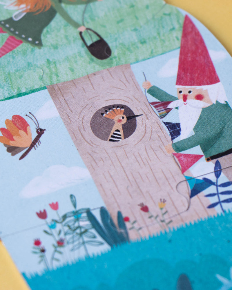 Children's book with illustrations of a gnome, flowers, and a castle on a yellow background