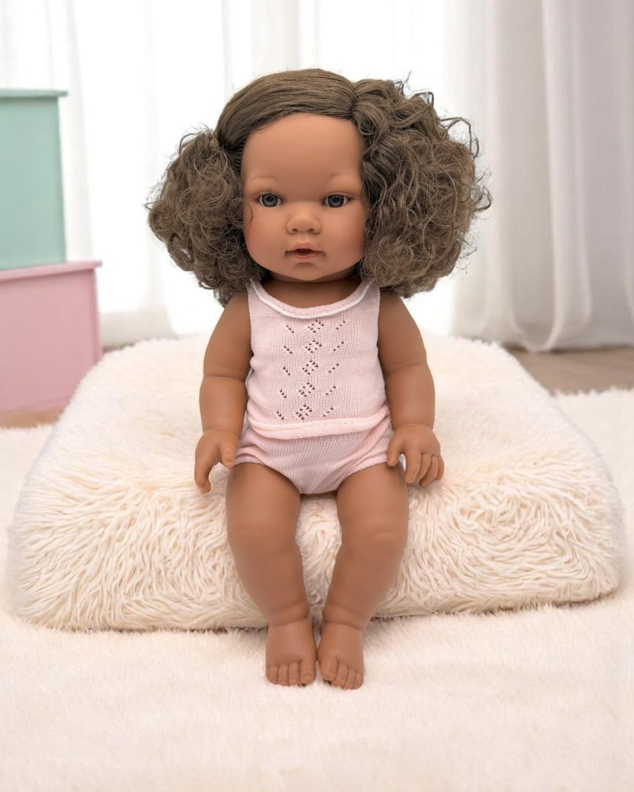 Real life baby doll Havana featuring natural curly brunette hair perfect for children's playroom diversity