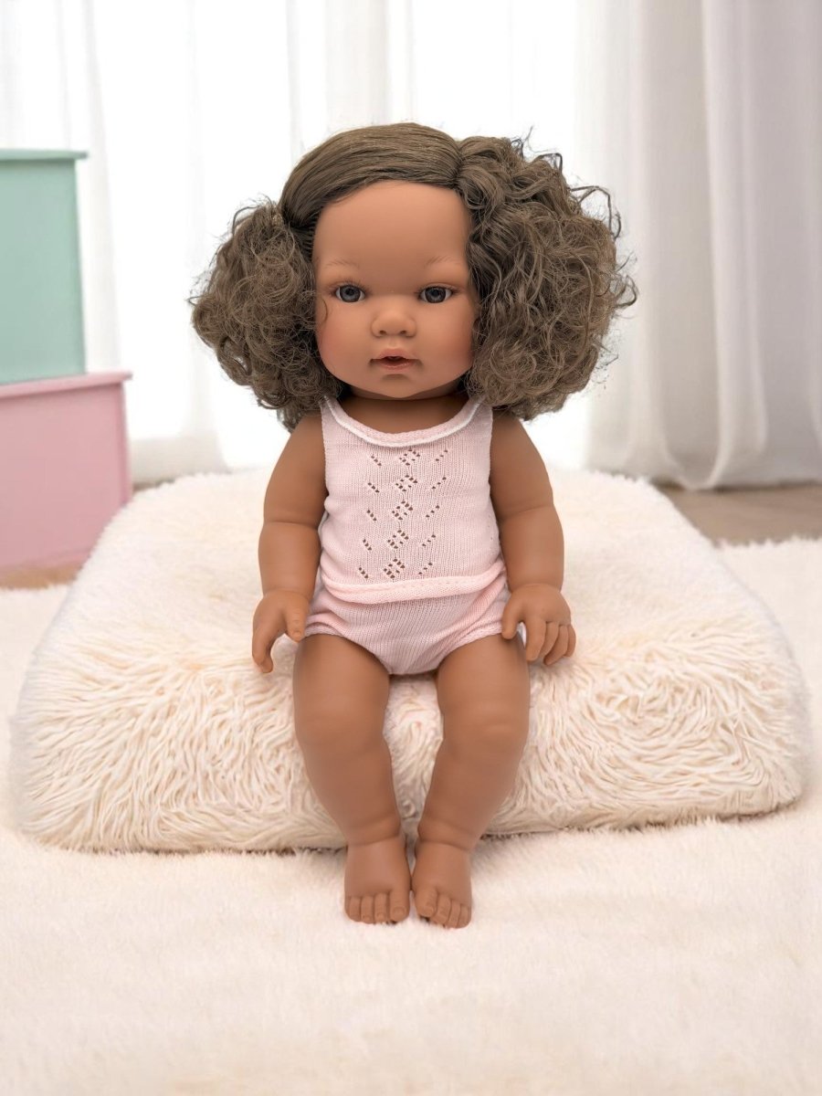 Real life baby doll Havana featuring natural curly brunette hair perfect for children's playroom diversity