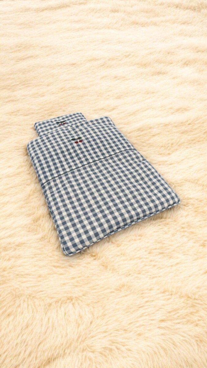 Handcrafted doll bedding set inspiring nurturing pretend play scenarios