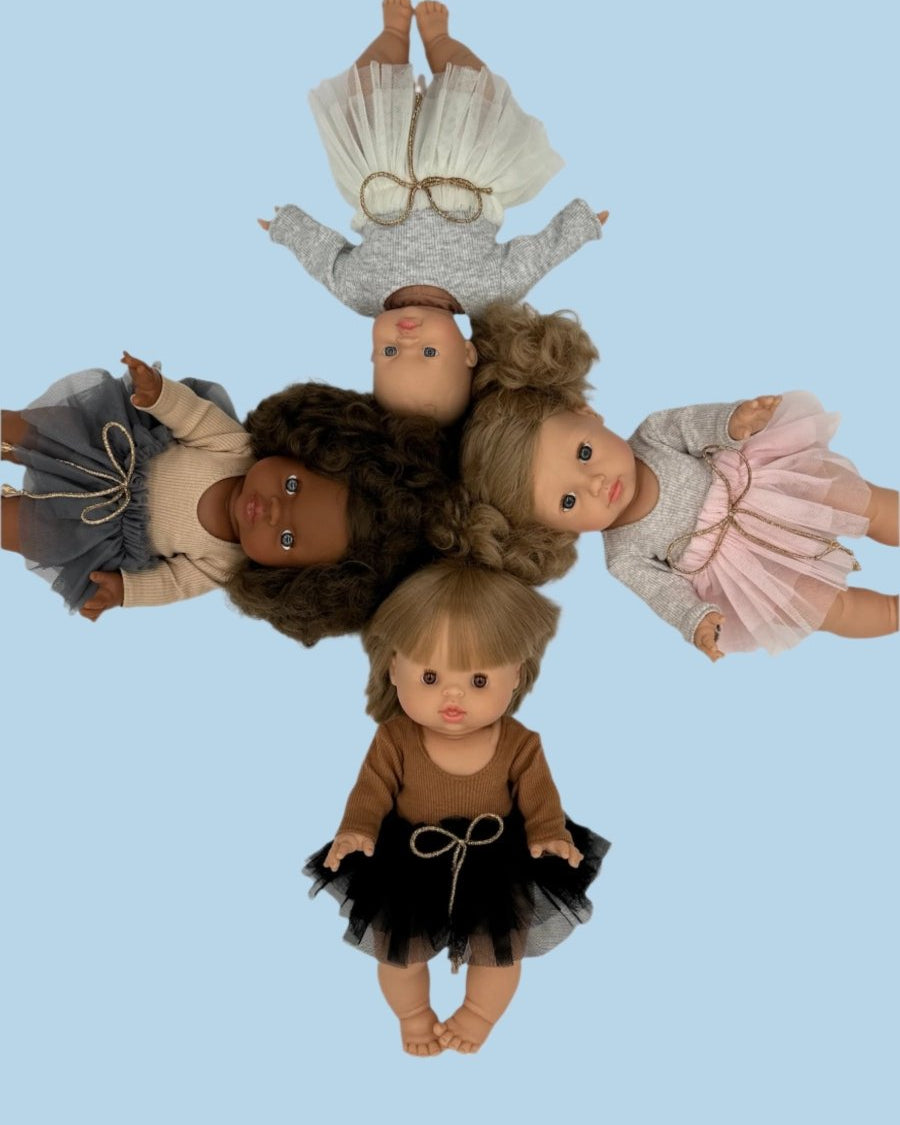 Pastel baby doll clothes with soft color palette