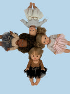Pastel baby doll clothes with soft color palette