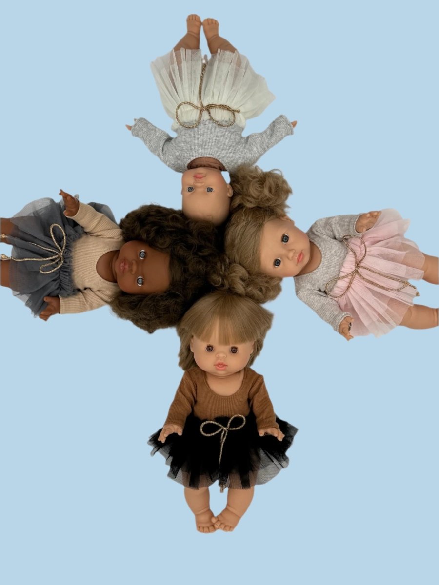 Pastel baby doll clothes with soft color palette