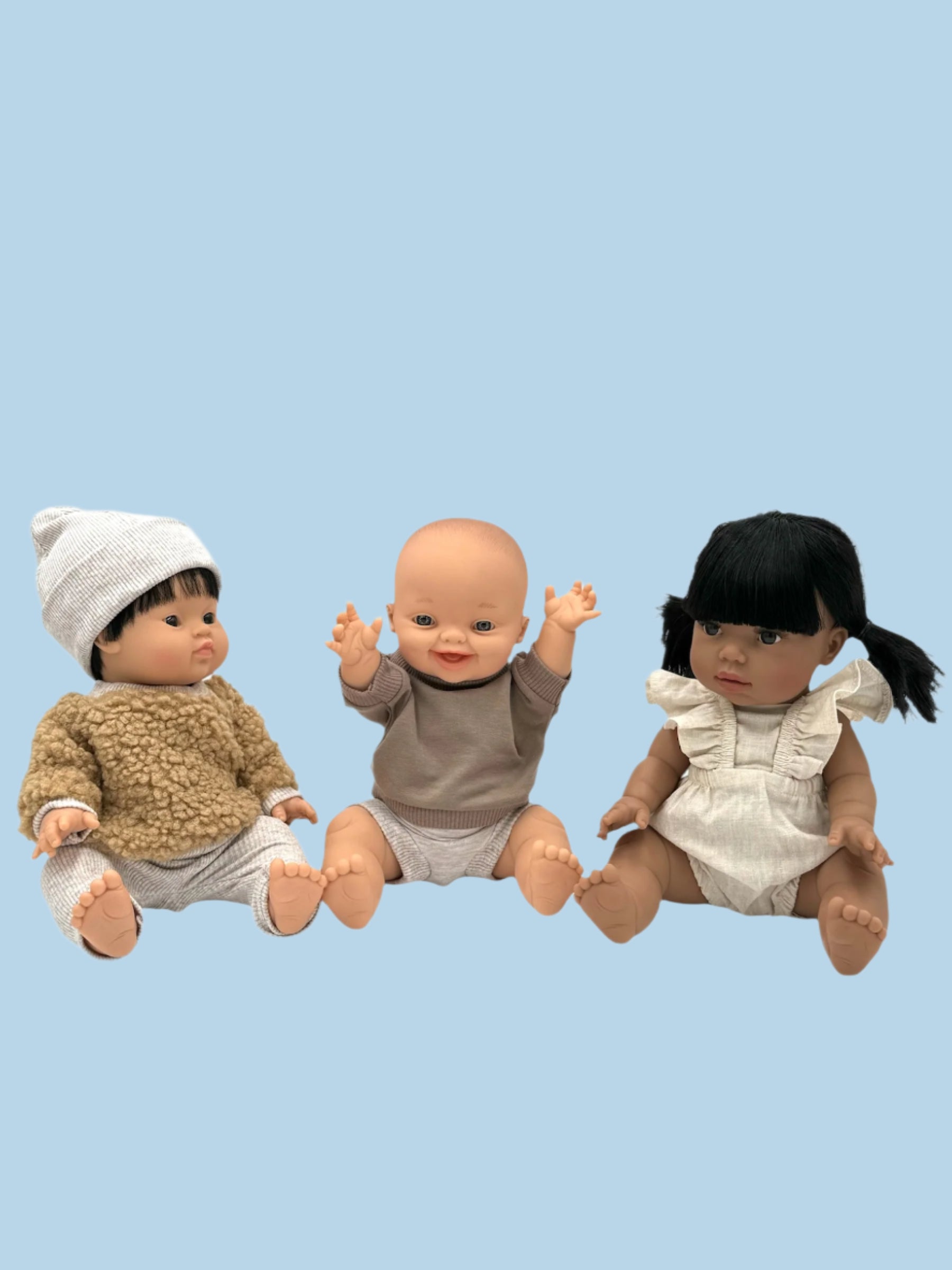 Hand-sewn baby doll clothes with meticulous attention